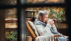 arranging home health care, older woman drinking coffee